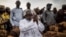 Adama Barrow, the flag-bearer of the coalition of the seven opposition political parties in Gambia, greets supporters during a gathering in the Buffer Zone district of Talinding, Nov. 29, 2016, on the last day of the presidential campaign in Gambia.