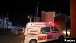 An ambulance carrying an injured person from an attack by al-Shabab gunmen on a hotel near the presidential residence arrives to the Shaafi hospital in Mogadishu, Somalia, Dec. 10, 2019. 