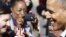 U.S. President Barack Obama smiles as he greets onlookers upon arriving at Newport News/Williamsburg International Airport in Williamsburg, Virginia, October 13, 2012. 
