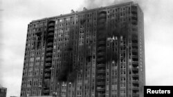 A building burns after being shelled in the Pofalici district in Sarajevo April 1992. Serbia may send Ratko Mladic to face genocide charges in The Hague within four days, a justice official said May 30, 2011, despite riots by nationalists angry at the Bos