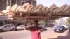 Sameh Soltan, a bread vendor: In Egyptian Arabic, &ldquo;bread&rdquo; and &ldquo;life&rdquo; are the same word. &ldquo;I feel bad for the customers because prices are going up.&quot; Soltan sells bread in the Cairo suburbs. He learned how to balance the bread on his head from his brother and they carry the bread without vehicles because the cost of transportation would further raise prices in their already poor community. &ldquo;It looks like I work in circus and it&#39;s fun. But no it&#39;s really tiring job. Everyday I go back home sleep like I&rsquo;m dead.&quot;