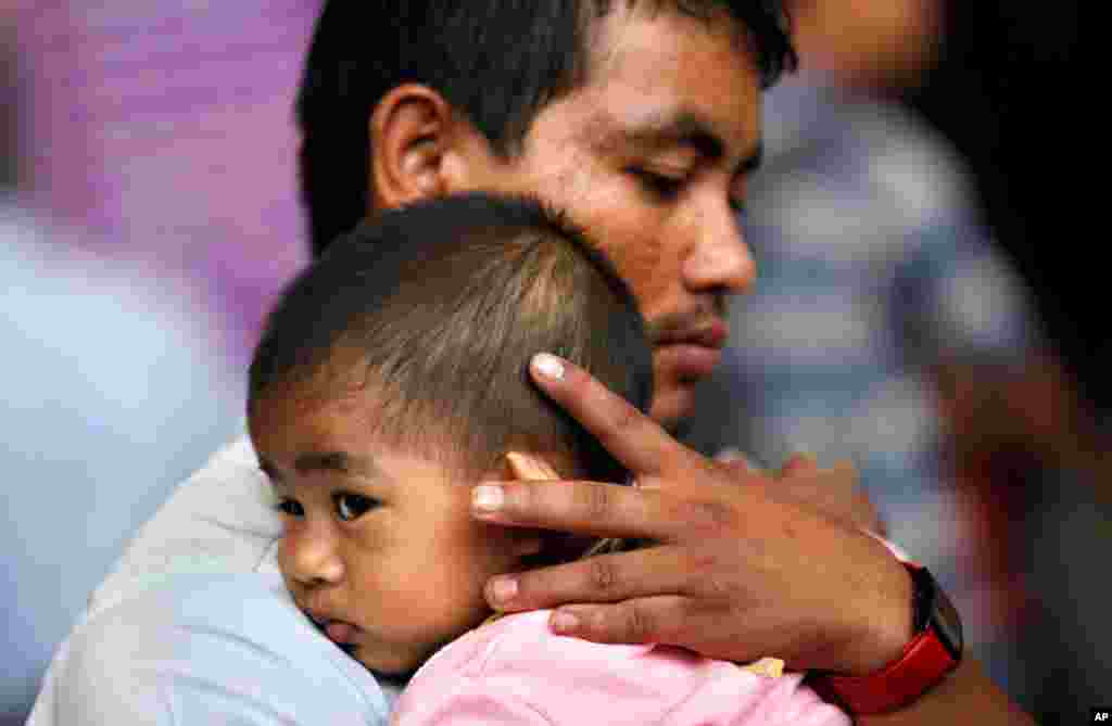 President John F. Kennedy and his wife Jacqueline Kennedy are greeted by an enthusiastic crowd upon their arrival at Dallas Love Field, Texas, Nov. 22, 1963.