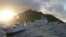 FILE - Chinese marine surveillance ship Haijian No. 51 (C) sails near Japan Coast Guard vessels (R and L) and a Japanese fishing boat (front 2nd L) as Uotsuri island, one of the disputed islands, called Senkaku in Japan and Diaoyu in China, is in the background, July 1, 2013.