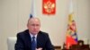 FILE - Russian President Vladimir Putin is seen during a meeting at the Novo-Ogaryovo residence outside Moscow, Russia, April 7, 2020. 