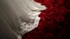 FILE PHOTO - A wedding dress is displayed during a group wedding ceremony hosted by the French Pavilion at the Shanghai World Expo May 11, 2010.REUTERS/Aly Song