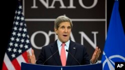 U.S. Secretary of State John Kerry gestures during a news conference, at NATO headquarters in Brussels, Belgium, April 23, 2013.
