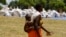 A Zimbabwean mother arrives to collect her monthly rations of food aid from Rutaura Primary School in the Rushinga district of Mt Darwin about 254km north of Harare, March 7, 2013. More than 6 million people across Angola, Lesotho, Malawi and Zimbabwe are at risk of severe food shortages because of repeated cycles of drought and flooding. REUTERS/Philimon Bulawayo 