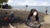 FILE - A fisherman prepares fish beside Lake Malawi, 120 km east of the capital Lilongwe. Malawi introduced the $75 visa fee from Oct. 1, 2015, in a bid to boost government revenue.