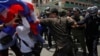 Protesters clash with police as they attempt to go toward the Phnom Penh Municipal Court, in central Phnom Penh, file photo. 
