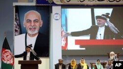 Afghan President Ashraf Ghani speaks on the last day of the Afghan Loya Jirga meeting in Kabul, Afghanistan, May 3, 2019. 