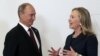 Russian President Vladimir Putin, meets U.S. Secretary of State Hillary Clinton on her arrival at the APEC summit in Vladivostok, Russia, Sept. 8, 2012.