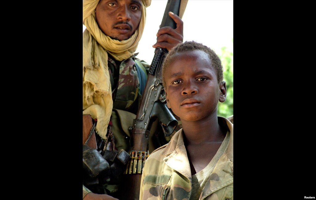 A Chadian army child soldier is seen in Am Timan, Chad. Chad pledged in May of 2007 to work to demobilize hundreds of child soldiers fighting in the ranks of the government army and rebel groups across conflict-torn central Africa.