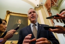 FILE - U.S. Senator Thom Tillis (R-NC) talks to reporters prior to the resumption of the Senate impeachment trial of U.S. President Donald Trump at the U.S. Capitol in Washington, Jan. 30, 2020.