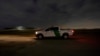 A U.S. Customs and Border Protection truck drives by a road adjacent to the U.S.-Mexico border, March 22, 2021, in Hidalgo, Texas. 