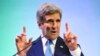 FILE - U.S. Secretary of State John Kerry gestures while speaking about climate change in Jakarta, Feb. 16, 2014.