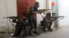 FILE - Somali security forces hold their positions near the mayor's office following a blast in Mogadishu, Somalia, on Jan. 22, 2023. The Somali government claimed on Oct. 4, 2023, that its troops had killed hundreds of al-Shabab militants in the past two months.