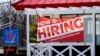 A hiring sign shows outside of restaurant in Prospect Heights, Illinois, March 21, 2021.