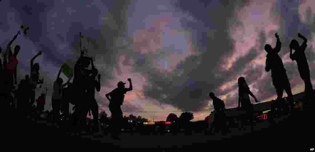 Angry protestors in Ferguson, Missouri, Aug. 18, 2014, for Michael Brown. Brown&#39;s shooting has sparked more than a week of protests, riots and looting.