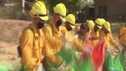 Military, Firefighters Join Forces Against Common Enemy