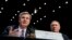 FBI Director Christopher Wray, accompanied by CIA Director Mike Pompeo, right, speaks at a Senate Select Committee on Intelligence hearing on worldwide threats, in Washington, Feb. 13, 2018. 