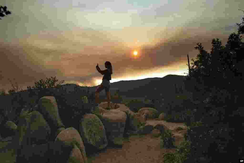 Mara Schumann photographs a plume of smoke from the Ferguson Fire in Yosemite National Park, California.