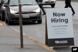 FILE - A drive-up job fair in Seattle, Washington on May 16, 2020. Some businesses say they do not want to hire members of Gen Z. (AP Photo/Ted S. Warren)