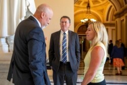 From left, Rep. Chip Roy, R-Texas, Rep. Thomas Massie, R-Ky., and Rep. Marjorie Taylor Greene, R-Ga. talk on Capitol Hill in Washington, Aug. 24, 2021. Lawmakers were recalled to Washington amid talks on a $3.5 trillion budget blueprint.