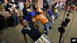 FILE - Youths dance in the a rap band entertaining meeting of the National Youth Council, Jan. 4, 2013. In Cameroon, authorities are banning the sale or broadcast of some popular music including a new dance hit by the prominent Cameroonian rapper, Franko.