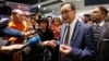 Cambodia's self-exiled opposition party founder Sam Rainsy, who has vowed to return to his home country, talks to supporters after being prevented from checking-in for a flight from Paris to Bangkok at Roissy Airport in Paris, France November 7, 2019