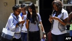 FILE - with the new app on their mobile device, people can receive and share information in real-time in the event of a health crisis, epidemic(s), and natural disasters.