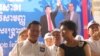 Cambodia National Rescue Party lawmaker Tioulong Saumura talks to Kem Sokha the new president of CNRP during the party's convention on March 2, 2017. (Aun Chhengpor/VOA Khmer) 
