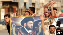 Ополченцы «Армии Махди» с портретом имама Муктады Садра