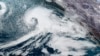 Citra satelit yang disediakan oleh NOAA ini menunjukkan sistem badai yang mendekati Pantai barat AS, Selasa, 3 Januari 2023, pukul 18.36 petang waktu setempat. (NOAA via AP)