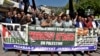 Protesters in Muzaffarabad, Pakistan, chant slogans against Israeli airstrikes on Gaza at a rally to show solidarity with Palestinian people on Oct. 10, 2023.