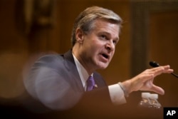 FBI - Director Christopher Wray testifies during a hearing, on Capitol Hill, May 7, 2019, in Washington.