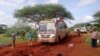 FILE - Kenyan security forces and others gather around the scene on an attack outside the town of Mandera, near the Somali border in northeastern Kenya, Nov. 22, 2014. 