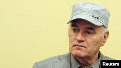 FILE - Former Bosnian Serb commander Ratko Mladic appears in court at the International Criminal Tribunal for the former Yugoslavia (ICTY) in the Hague, Netherlands, June 3, 2011.