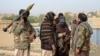 FILE - A group of Taliban fighters are seen in Ghazni province, Afghanistan, April 18, 2015.