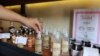 120ml-bottles of hand sanitizers produced by Samai Distillery​ are on display at its shop in Phnom Penh, Cambodia, March 31, 2020. (Phorn Bopha /VOA Khmer) 