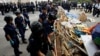Police demolish a barricade set up by pro-democracy protesters outside the government headquarters in Hong Kong, Dec. 11, 2014. 