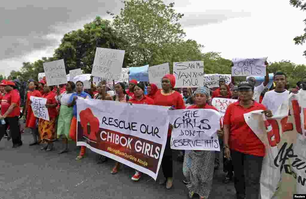 Members of various civil society organisations (CSOs) protest against the delay in securing the release of the abducted schoolgirls who were kidnapped, in Abuja April 30, 2014. Dozens of protesters gathered outside Nigeria's parliament on Wednesday called