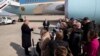 FILE - President Donald Trump speaks with reporters as he boards Air Force One as he departs, Feb. 18, 2020, at Andrews Air Force Base, Md.
