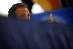 New York Governor Andrew Cuomo speaks to reporters during a news conference at the National Press Club after meeting with President Donald Trump about response to the coronavirus disease pandemic at the White House, May 27, 2020.