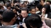 Gooi Soon Seng, lawyer for Indonesia suspect Siti Aisyah in the ongoing assassination investigation, is surrounded by journalists inside Sepang court in Sepang, Malaysia Wednesday, March 1, 2017.