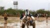 Newly arrived Somali refugees ride a donkey along the street at the Ifo Extension refugee camp in Dadaab, near the Kenya-Somalia border, October 19, 2011. 