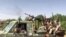 FILE - Para pejuang mengendarai truk pikap yang dilengkapi menara di distrik Nil Timur, Khartoum, dalam video selebaran yang dirilis oleh Pasukan Dukungan Cepat (RSF) paramiliter Sudan, 23 April 2023. (Rapid Support Forces (RSF) / AFP) 