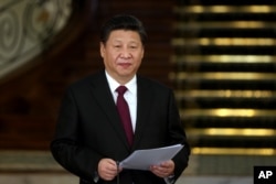 FILE - Chinese President Xi Jinping speaks with media in a joint press conference with his Iranian counterpart Hassan Rouhani after their meeting at the Saadabad Palace in Tehran, Iran, Jan. 23, 2016.