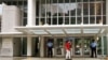FILE - Security guards stand at the entrance of the headquarters of the World Bank, in Washington, Aug. 1, 2004.