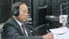 FILE - Government spokesman Phay Siphan sits in the VOA studio in Phnom Penh in 2012.