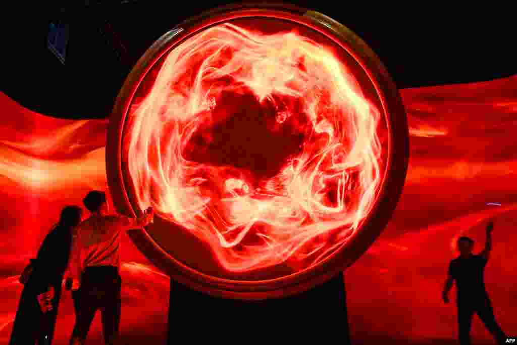 People visit the exhibition &quot;Harry Potter: Visions of Magic interactive&quot; at Resort World Sentosa in Singapore.